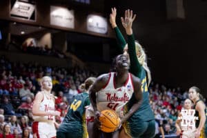 Nebraska Cornhusker forward Eliza Maupin (21) drives to the basket against North Dakota State Bison forward Avery Koenen (22) during a college basketball game on Sunday, Nov 16, 2025, in Sioux Falls, South Dakota. Photo by John S. Peterson.