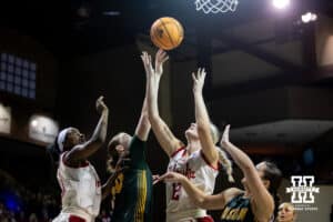 Nebraska Cornhusker forward Jessica Petrie (12) reaches for the rebound against the North Dakota State Bison during a college basketball game on Sunday, Nov 16, 2025, in Sioux Falls, South Dakota. Photo by John S. Peterson.