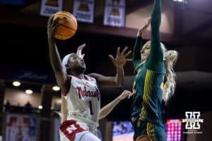 Nebraska Cornhusker guard Hailey Weaver (1) makes a lay up against North Dakota State Bison forward Avery Koenen (22) during a college basketball game on Sunday, Nov 16, 2025, in Sioux Falls, South Dakota. Photo by John S. Peterson.