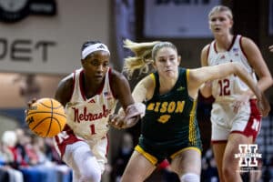 Nebraska Cornhusker guard Hailey Weaver (1) dribbles past North Dakota State Bison guard Amelia Hobson (8) during a college basketball game on Sunday, Nov 16, 2025, in Sioux Falls, South Dakota. Photo by John S. Peterson.