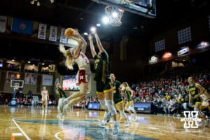 Nebraska Cornhusker guard Britt Prince (23) makes a lay up against North Dakota State Bison guard Marisa Frost (12) during a college basketball game on Sunday, Nov 16, 2025, in Sioux Falls, South Dakota. Photo by John S. Peterson.