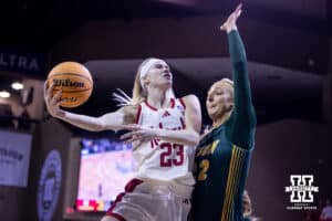 Nebraska Cornhusker guard Britt Prince (23) makes a lay up against North Dakota State Bison forward Avery Koenen (22)in the first quarter during a college basketball game on Sunday, Nov 16, 2025, in Sioux Falls, South Dakota. Photo by John S. Peterson.