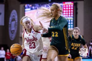 Nebraska Cornhusker guard Britt Prince (23) drives to the basket against North Dakota State Bison forward Avery Koenen (22) in the first quarter during a college basketball game on Sunday, Nov 16, 2025, in Sioux Falls, South Dakota. Photo by John S. Peterson.