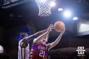 Nebraska Cornhusker forward Pryce Sandfort (21) makes a lay up against Oklahoma Sooner forward Derrion Reid (35) in the second half during a college men’s basketball game on Saturday, Nov 15, 2025, in Sioux Falls, South Dakota. Photo by John S. Peterson.