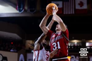 Nebraska Cornhusker guard Cale Jacobsen (31) makes a lay up and draws a foul from Oklahoma Sooner guard Jeff Nwankwo (3) in the second half during a college men’s basketball game on Saturday, Nov 15, 2025, in Sioux Falls, South Dakota. Photo by John S. Peterson.
