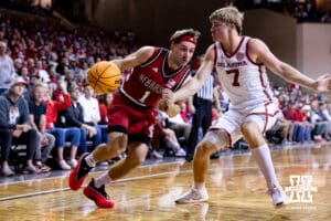 Nebraska Cornhusker guard Sam Hoiberg (1) drive the baseline against Oklahoma Sooner guard Dayton Forsythe (7) in the first half during a college men’s basketball game on Saturday, Nov 15, 2025, in Sioux Falls, South Dakota. Photo by John S. Peterson.
