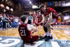 Nebraska Cornhusker forward Pryce Sandfort (21) gets some help from Connor Essegian and Braden Frager after a foul against the Oklahoma Sooners during a college men’s basketball game on Saturday, Nov 15, 2025, in Sioux Falls, South Dakota. Photo by John S. Peterson.