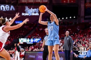 Creighton Bluejay guard Neleigh Gessert (23) makes a three point shot against Nebraska Cornhusker guard Callin Hake (14) during a college women’s basketball game on Wednesday, Nov. 12, 2025, in Lincoln, Nebraska. Photo by John S. Peterson.
