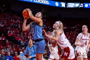Creighton Bluejay guard Allison Heathcock (13) makes a lay up against Nebraska Cornhusker guard Britt Prince (23) in the third quarter during a college women’s basketball game on Wednesday, Nov. 12, 2025, in Lincoln, Nebraska. Photo by John S. Peterson.