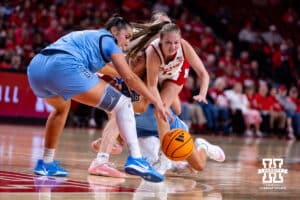 Nebraska Cornhusker guard Claire Johnson (5) and Creighton Bluejay forward Grace Boffeli (42) go after a loose ball during a college women’s basketball game on Wednesday, Nov. 12, 2025, in Lincoln, Nebraska. Photo by John S. Peterson.