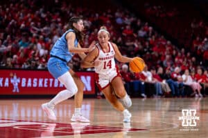 Nebraska Cornhusker guard Callin Hake (14) drives the lane against Creighton Bluejay guard Allison Heathcock (13) during a college women’s basketball game on Wednesday, Nov. 12, 2025, in Lincoln, Nebraska. Photo by John S. Peterson.