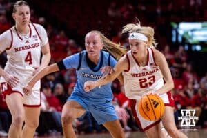 Nebraska Cornhusker guard Britt Prince (23) drives to the basket against Creighton Bluejay guard Ava Zediker (24) in the first quarter during a college women’s basketball game on Wednesday, Nov. 12, 2025, in Lincoln, Nebraska. Photo by John S. Peterson.