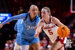 Creighton Bluejay guard Norah Gessert (30) defends against Nebraska Cornhusker guard Claire Johnson (5) during a college women’s basketball game on Wednesday, Nov. 12, 2025, in Lincoln, Nebraska. Photo by John S. Peterson.