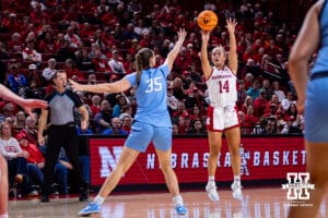 Nebraska Cornhusker guard Callin Hake (14) makes a three-point shot against Creighton Bluejay center Elizabeth Gentry (35) in the first quarter during a college women’s basketball game on Wednesday, Nov. 12, 2025, in Lincoln, Nebraska. Photo by John S. Peterson.