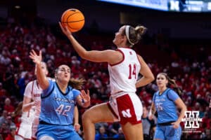 Nebraska Cornhusker guard Callin Hake (14) makes a lay up against Creighton Bluejay forward Grace Boffeli (42) in the first quarter during a college women’s basketball game on Wednesday, Nov. 12, 2025, in Lincoln, Nebraska. Photo by John S. Peterson.
