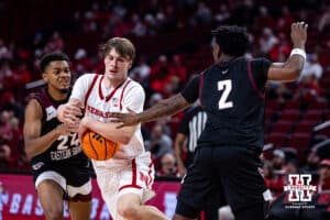 Nebraska Cornhusker forward Braden Frager (5) drives between forward Levi Beckwith (24) and guard Jaden Johnson (2) in the second half during a college men’s basketball game on Tuesday, November 11, 2025, in Lincoln, Nebraska. Photo by John S. Peterson.