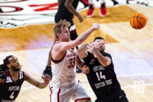 Nebraska Cornhusker forward Leo Curtis (33) tips the ball away from Maryland Eastern Shore Hawk forward Joseph Locandro (14) in the second half during a college men’s basketball game on Tuesday, November 11, 2025, in Lincoln, Nebraska. Photo by John S. Peterson.