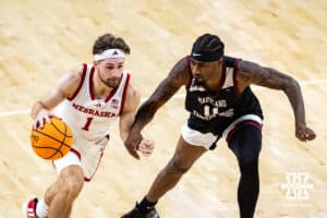 Nebraska Cornhusker guard Sam Hoiberg (1) dribbles the ball against Maryland Eastern Shore Hawk guard Javoy Thompson (11) in the second half during a college men’s basketball game on Tuesday, November 11, 2025, in Lincoln, Nebraska. Photo by John S. Peterson.