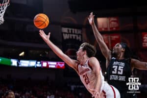 Nebraska Cornhusker forward Pryce Sandfort (21) makes a lay up agianst Maryland Eastern Shore Hawk forward Christopher Flippin (35) in the first half during a college men’s basketball game on Tuesday, November 11, 2025, in Lincoln, Nebraska. Photo by John S. Peterson.