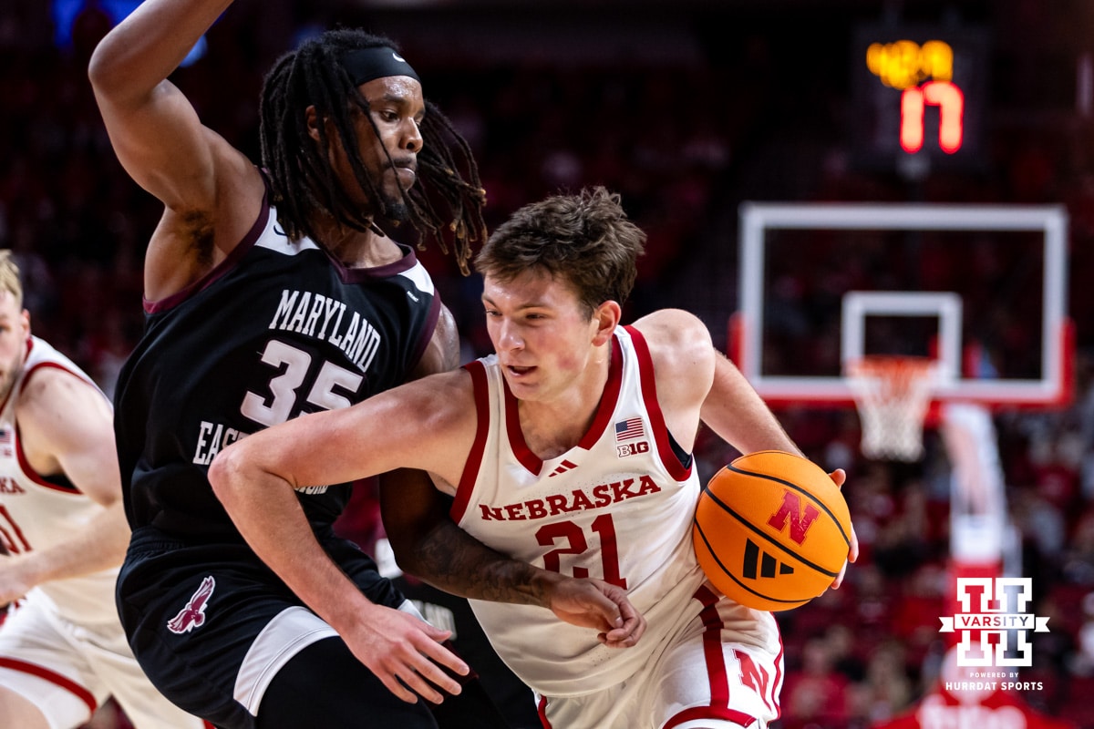 Nebraska Cornhusker forward Pryce Sandfort (21) drives the lane against Maryland Eastern Shore Hawk forward Christopher Flippin (35) during a college men’s basketball game on Tuesday, November 11, 2025, in Lincoln, Nebraska. Photo by John S. Peterson.