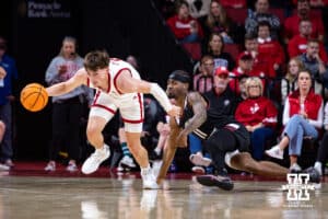 Nebraska Cornhusker guard Connor Essegian (0) breaks away from Maryland Eastern Shore Hawk guard Javoy Thompson (11) in the first half during a college men’s basketball game on Tuesday, November 11, 2025, in Lincoln, Nebraska. Photo by John S. Peterson.