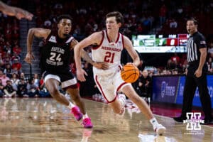 Nebraska Cornhusker forward Pryce Sandfort (21) drives the lane against Maryland Eastern Shore Hawk forward Levi Beckwith (24) during a college men’s basketball game on Tuesday, November 11, 2025, in Lincoln, Nebraska. Photo by John S. Peterson.