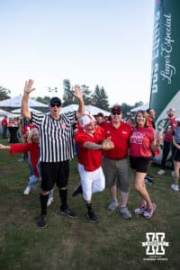 Nebraska Cornhusker fans tailgating, pose for a photo before the college football game against the UCLA Bruins on Saturday, November 8, 2025, in Pasadena, California. Photo by Shane Adams.