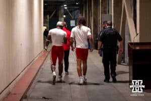 Nebraska Cornhuskers Emmett Johnson and TJ Lateef escorted back to the locker room after the press conference during a college football game against the UCLA Bruins on Saturday, November 8, 2025, in Pasadena, California. Photo by John S. Peterson.