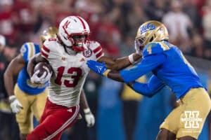 Nebraska Cornhusker wide receiver Nyziah Hunter (13) stiff arms UCLA Bruin defensive back Key Lawrence (4) while running with the ball in the fourth quarte during a college football game on Saturday, November 8, 2025, in Pasadena, California. Photo by John S. Peterson.
