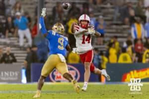 Nebraska Cornhusker quarterback TJ Lateef (14) throws a pass against UCLA Bruin linebacker Jalen Woods (9) in the fourth quater during a college football game on Saturday, November 8, 2025, in Pasadena, California. Photo by John S. Peterson.