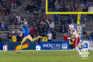 UCLA Bruin defensive back Aaron Williams (7) makes a catch againt Nebraska Cornhusker defensive back Rex Guthrie (21) during a college football game on Saturday, November 8, 2025, in Pasadena, California. Photo by John S. Peterson.