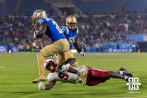 Nebraska Cornhusker linebacker Vincent Shavers Jr. (9) dives to tackle UCLA Bruin running back Jaivian Thomas (21) during a college football game on Saturday, November 8, 2025, in Pasadena, California. Photo by John S. Peterson.