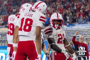 Nebraska Cornhusker running back Emmett Johnson (21) celebrates his touchdown with Quinn Clark, and Carter Nelson in the third quarter against the UCLA Bruins during a college football game on Saturday, November 8, 2025, in Pasadena, California. Photo by John S. Peterson.