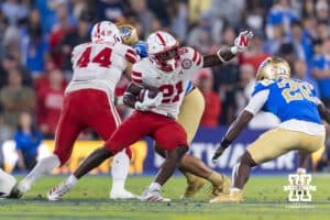 Nebraska Cornhusker running back Emmett Johnson (21) runs with the ball against UCLA Bruin defensive back Scooter Jackson (28) in the second quarter during a college football game on Saturday, November 8, 2025, in Pasadena, California. Photo by John S. Peterson.