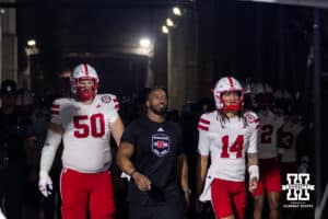 Nebraska Cornhuskers strength and conditioning coach Corey Campbell leads Huskers to the field with Rocco Spindler and TJ Lateef to take on the UCLA Bruins during a college football game on Saturday, November 8, 2025, in Pasadena, California. Photo by John S. Peterson.