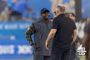 Nebraska Cornhusker head coach Matt Rhule and UCLA Bruin interim head coach Tim Skipper meet during warm-ups before the college football game on Saturday, November 8, 2025, in Pasadena, California. Photo by John S. Peterson.