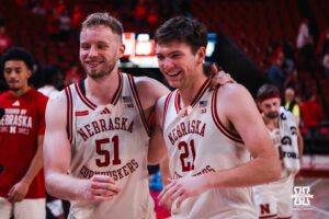 Nebraska Cornhuskers Rienk Mast (51) and Pryce Sandfort (21) celebrate a win after a basketball game against Florida International University on Saturday, November 8, 2025, in Lincoln, Nebraska. Photo by Brandon Tiedemann.