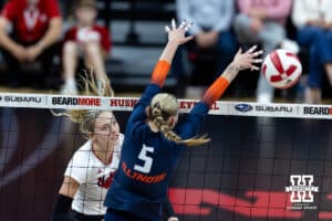 Nebraska Cornhusker opposite Allie Sczech (3) spikes the ball past Illinois Fighting Illini outside hitter Taylor de Boer (5) in the third set during a college volleyball match on Thursday, November 6, 2025, in Lincoln, Nebraska. Photo by John S. Peterson.