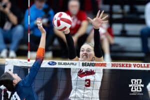 Nebraska Cornhusker opposite Allie Sczech (3) jumps to block Illinois Fighting Illini outside hitter Alyssa Aguayo (19) in the third set during a college volleyball match on Thursday, November 6, 2025, in Lincoln, Nebraska. Photo by John S. Peterson.