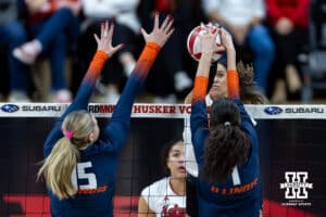 Nebraska Cornhusker outside hitter Skyler Pierce (21) spikes the ball against Illinois Fighting Illini opposite Auburn Tomkinson (1) in the third set during a college volleyball match on Thursday, November 6, 2025, in Lincoln, Nebraska. Photo by John S. Peterson.