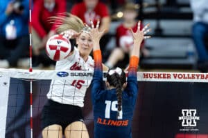 Nebraska Cornhusker middle blocker Andi Jackson (15) spkes the ball down the line against Illinois Fighting Illini outside hitter Alyssa Aguayo (19) in the third set during a college volleyball match on Thursday, November 6, 2025, in Lincoln, Nebraska. Photo by John S. Peterson.