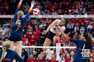 Nebraska Cornhusker middle blocker Rebekah Allick (5) spikes the ball against Illinois Fighting Illini middle blocker Gabby Dean (15) in the second set during a college volleyball match on Thursday, November 6, 2025, in Lincoln, Nebraska. Photo by John S. Peterson.