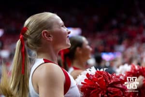 Nebraska Cornhusker cheer squad member performing during a college volleyball match against the Illinois Fighting Illini on Thursday, November 6, 2025, in Lincoln, Nebraska. Photo by John S. Peterson.