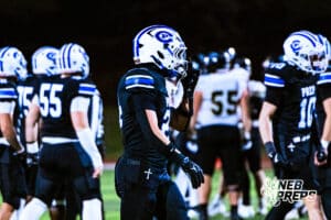 Creighton Preps Preston Woodward (24) is adjusting his facemask during a high school football game against Lincoln Southeast on Friday, October 31, 2025 in Omaha, Nebraska. Photo By Jack Stephens.