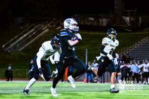 Creighton Preps Jake Kearney (22) is running the ball for a huge gain of yards during a high school football game against Lincoln Southeast on Friday, October 31, 2025 in Omaha, Nebraska. Photo By Jack Stephens.