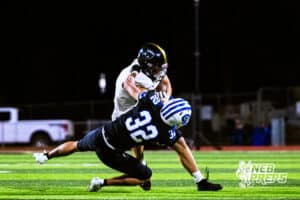 Lincoln Southeasts Nate Appleget (8) is stiff arming a defender during a high school football game at Creighton Prep on Friday, October 31, 2025 in Omaha, Nebraska. Photo By Jack Stephens.