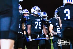 Creighton Preps Elisee Ahanti (75) is listening to pre game pep talk while in team huddle before a high school football game against Lincoln Southeast on Friday, October 31, 2025 in Omaha, Nebraska. Photo By Jack Stephens.