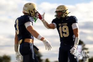 Elkhorn South's Bennet Gillman (3) celebrates a touchdown with Jaydon Sutko (19) against Millard West during a high school football game, Friday, October 31, 2025, Omaha, Nebraska. Photo by Braden Cochran.