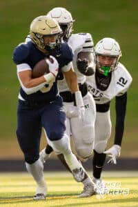 Elkhorn South running back Jaydon Sutko (19) evades wildcat defenders behind him during a high school football game, Friday, October 31, 2025, Omaha, Nebraska. Photo by Braden Cochran.