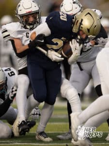 Elkhorn South running back Joey Kiscoan (20) fights through Millard West defenders during a high school football game, Friday, October 31, 2025, Omaha, Nebraska. Photo by Braden Cochran.
